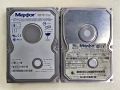 Two Maxtor drives from 2000 and 2004 &ndash; the smaller one bears the original Apple logo and part number.